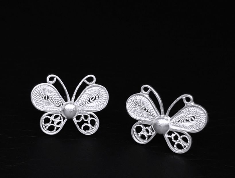 Topo de mariposas en plata.
